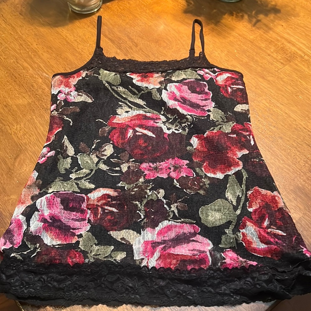 Beautiful black lace/floral tank top size Medium. Adjustable straps.